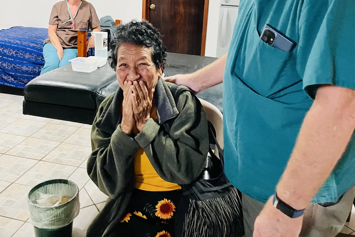 Woman cries tears of joy after her sight is restored.