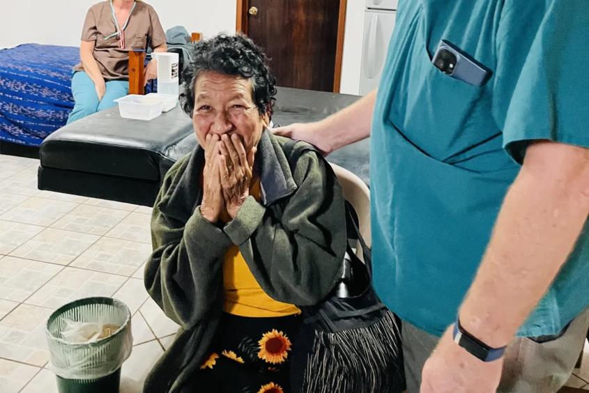Woman cries tears of joy after her sight is restored.